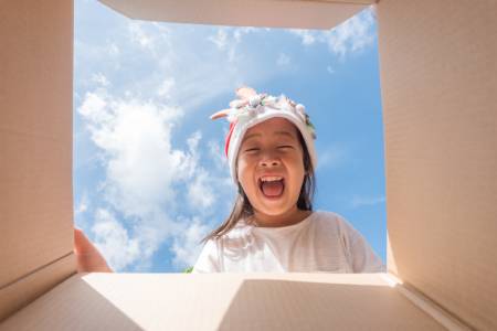 girl opening a box